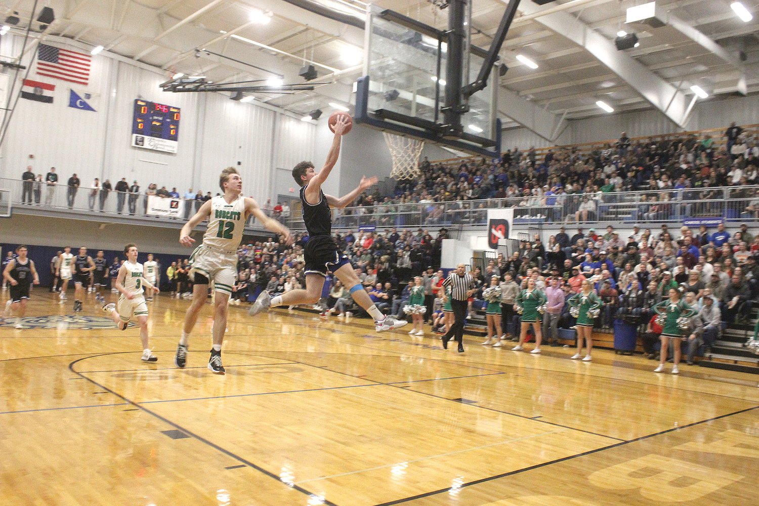 Norwood’s Garrett Davault glides through the air for a layup after getting an early steal to give the Pirates their first points of the game in the Cabool Holiday Tournament championship finals against undefeated Thayer.